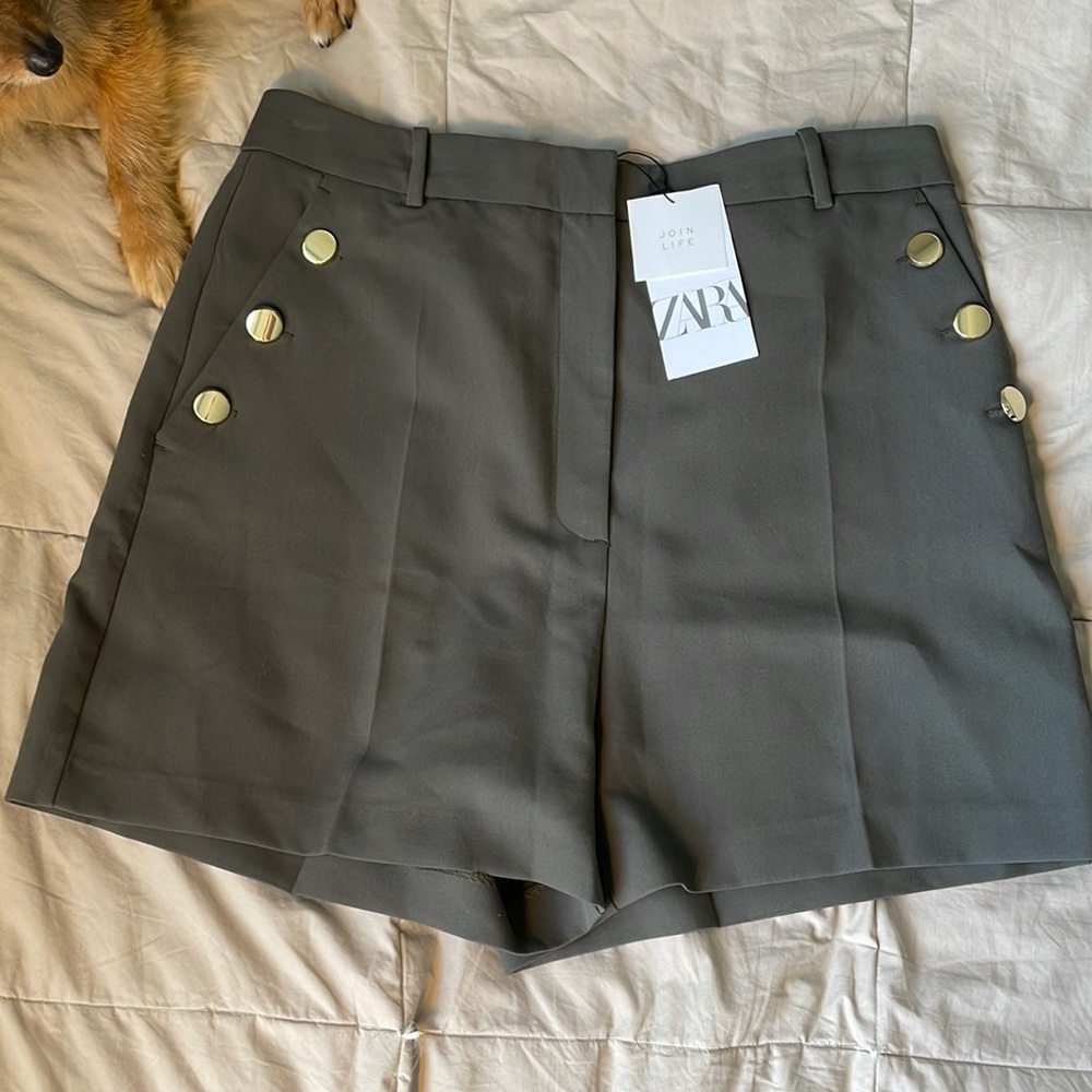 Green shorts dress up with gold buttons